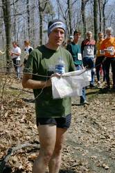 an orienteer hold s his map after the race