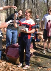 A bottle of wine is presented to Samantha Saeger.