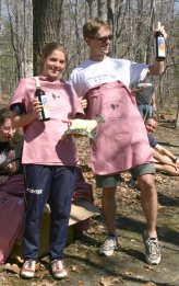 Samantha Saeger and Will Hawkins display their Billygoat t-shirts and goat trophies.